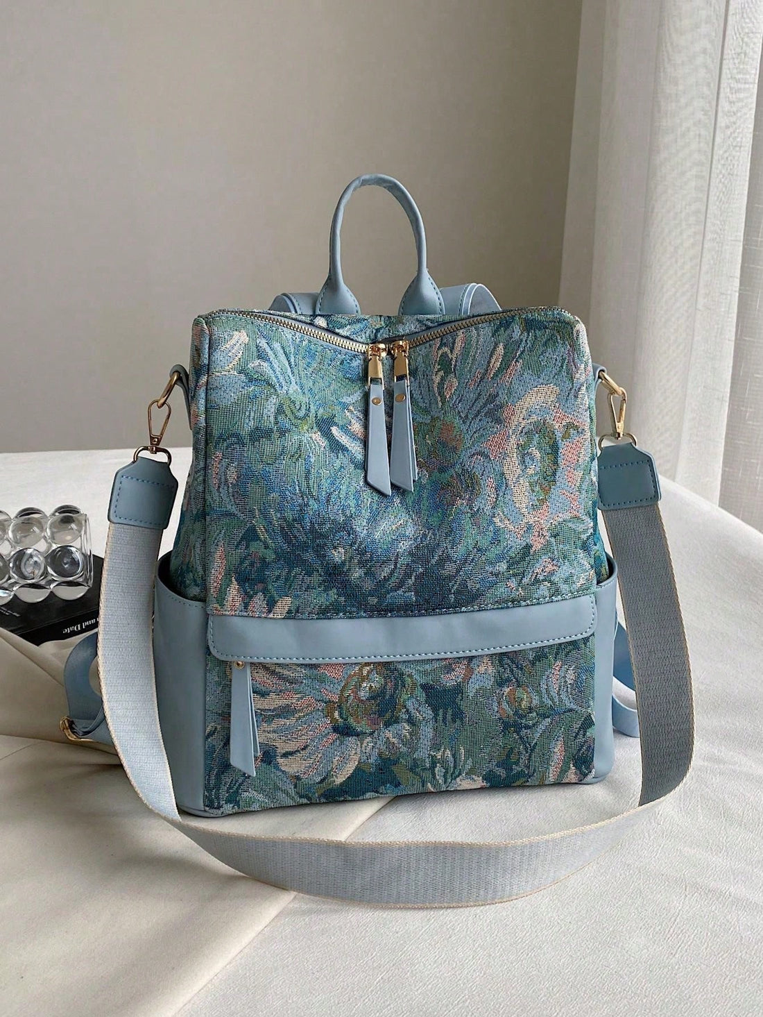 Introducing the Floral Graphic Waterproof Backpack, the ultimate school bag for every grade level. With its waterproof design and stylish floral graphic, this backpack is both functional and fashionable. Perfect for students of all ages, stay organized and on-trend with this must-have backpack.