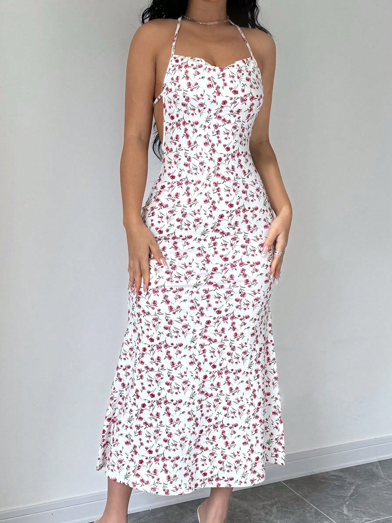 This Floral Halter Backless Dress is the perfect outfit for your summer vacation. The stylish floral design and halter neckline will elevate your look while the backless feature adds a touch of elegance. Stay comfortable and chic in this must-have vacation dress.