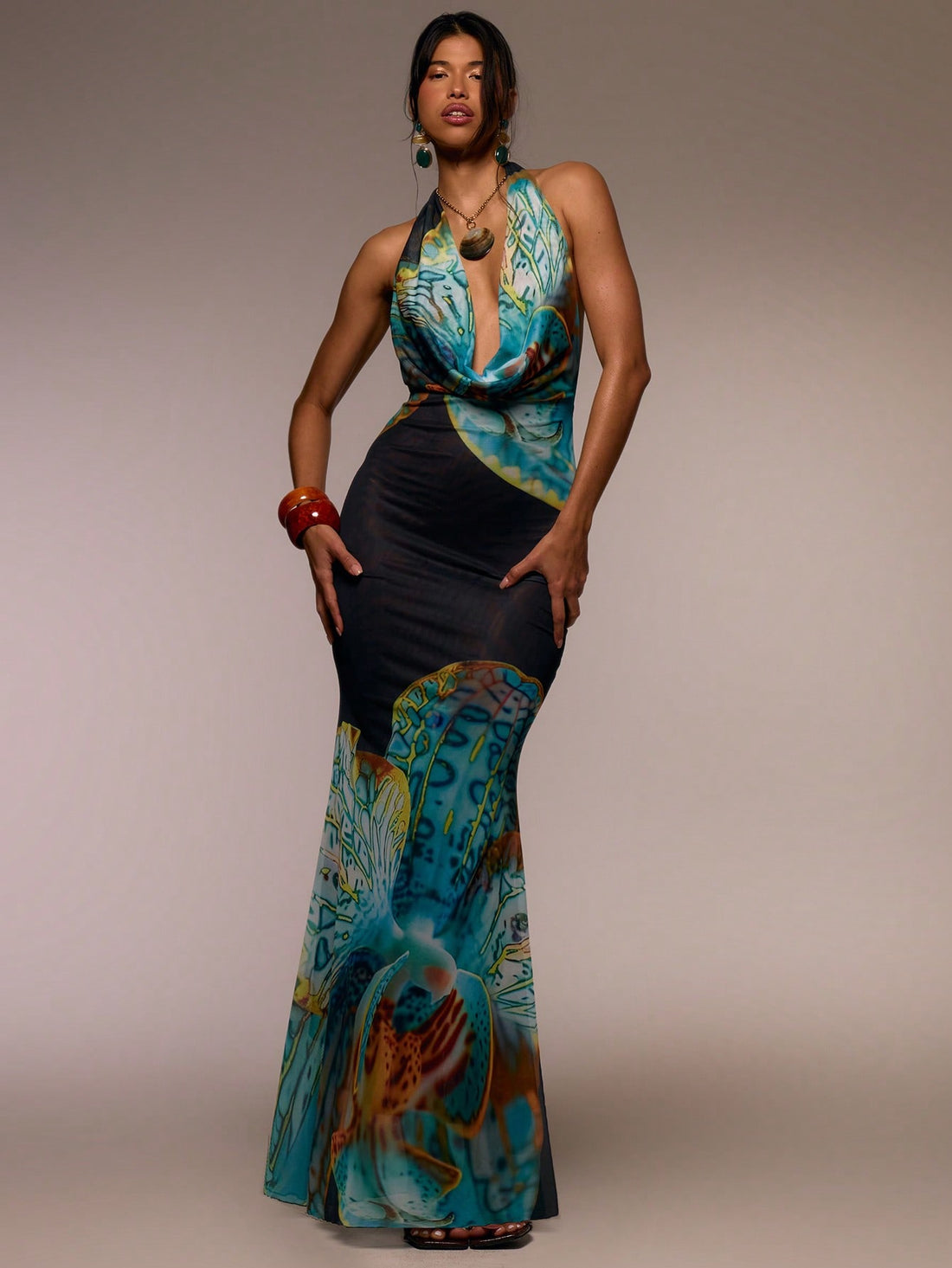 Step into sunshine and style with this Floral Maxi Dress featuring a flirty halter cowl neck. Its flowing silhouette and vibrant floral print make it your go-to for breezy spring days, lively summer festivals, or those effortless elegant moments on vacation. Lightweight and playful, it moves with you to keep the fun going from dawn to dusk. Embrace easy glamour and feel fabulous wherever your adventures take you!