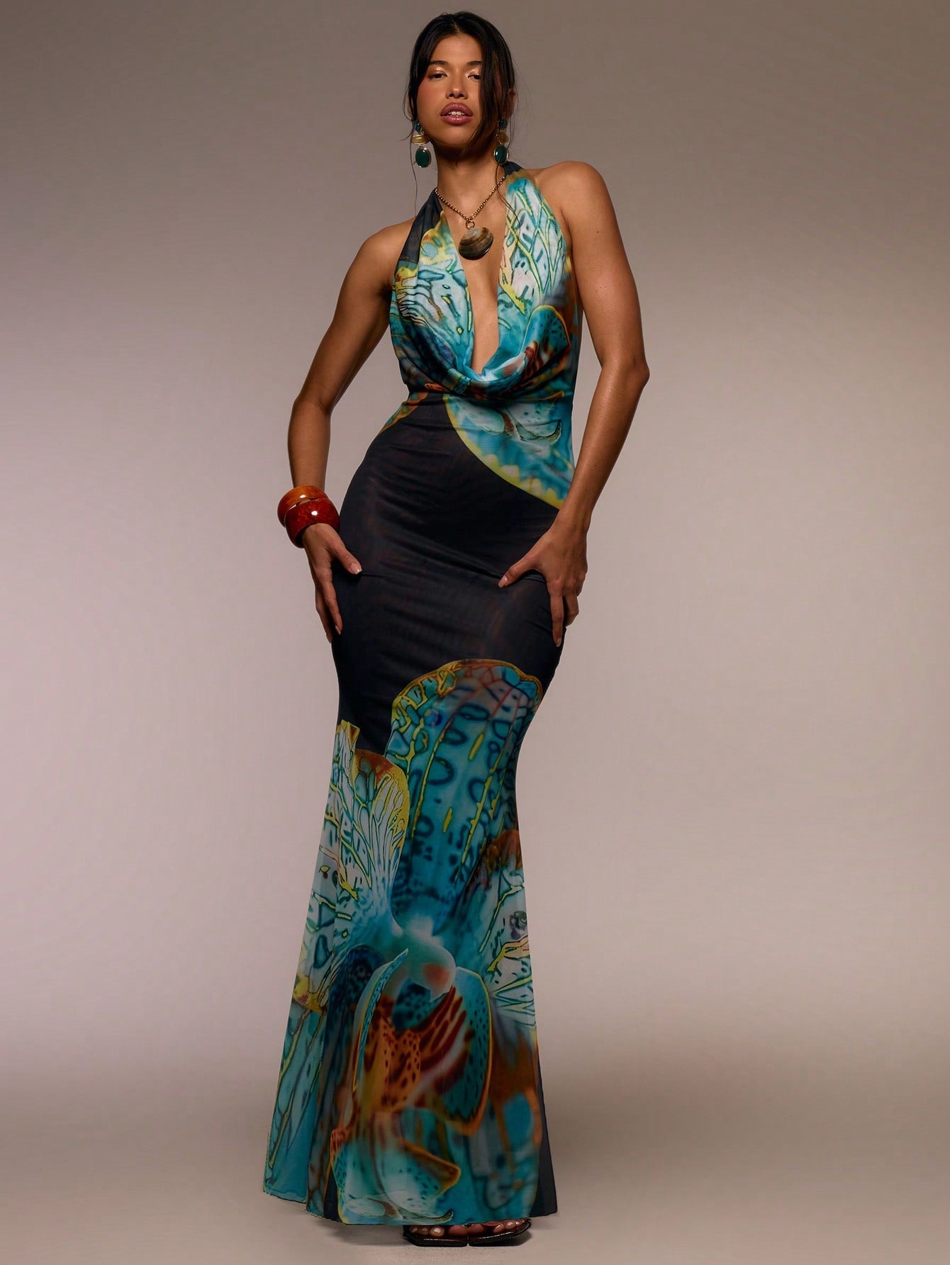 Step into sunshine and style with this Floral Maxi Dress featuring a flirty halter cowl neck. Its flowing silhouette and vibrant floral print make it your go-to for breezy spring days, lively summer festivals, or those effortless elegant moments on vacation. Lightweight and playful, it moves with you to keep the fun going from dawn to dusk. Embrace easy glamour and feel fabulous wherever your adventures take you!