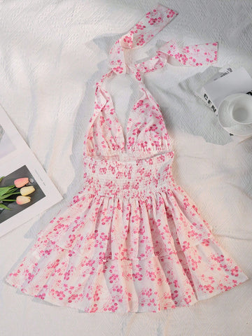 Get ready to turn heads this summer with our Floral Print Backless Halter Dress! With a vibrant floral pattern and a playful backless design, this dress is the perfect choice for all your summer events. Stay cool and stylish in this must-have piece for your wardrobe.