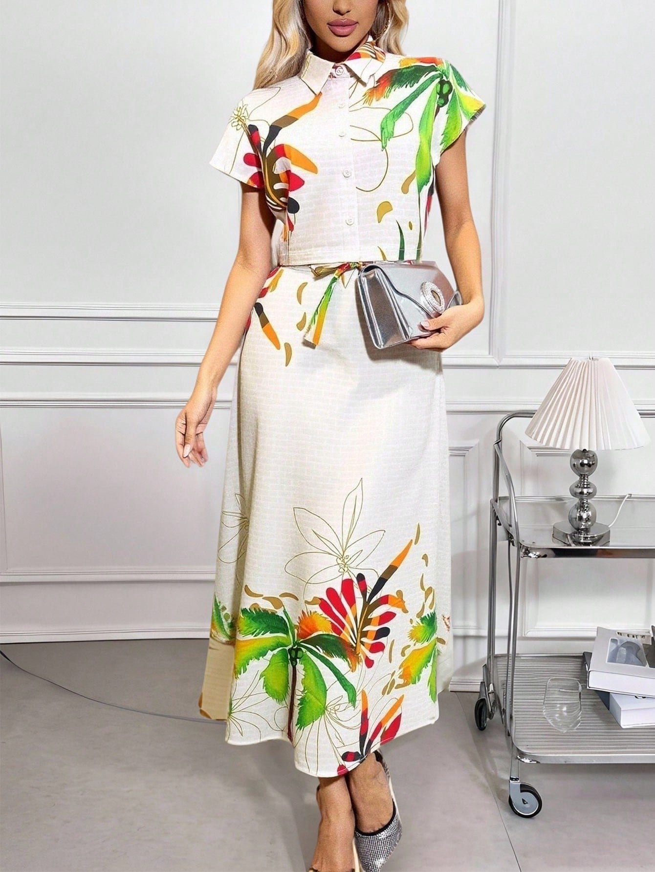 Bloom into summer with this charming two-piece set that's as fun as it is versatile. The floral button-down top pairs perfectly with the coordinating mini skirt, creating an effortless look that works for brunch dates, casual outings, or weekend adventures. Mix and match with your favorite accessories to keep your style fresh and exciting all season long. Perfect for anyone who loves a pop of color and timeless florals.