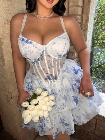 Front view of blue and white floral corset mini dress with sweetheart neckline and layered skirt