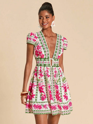 Escape to paradise in this vibrant floral mini dress, your ultimate companion for sun-soaked getaways. The striking botanical print in multicolor tones brings resort elegance to any casual occasion. Cut with a flattering high-waist silhouette and flowing A-line shape, it skims the body beautifully while the puff sleeves add a romantic boho flair. The deep V-neckline and flared hem create an effortlessly chic look perfect for beach days, poolside lounging, and festival celebrations. 