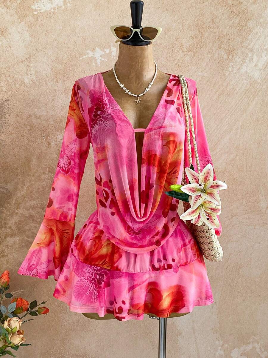 Elevate your festival wardrobe with this stunning floral mini dress. Featuring a flattering deep V-neckline, asymmetrical ruffle hem, and tiered layers, this piece combines bohemian charm with modern edge. The flare sleeves and A-line silhouette create a graceful, feminine look perfect for beach days and music festivals alike. Crafted from breathable mesh fabric with a comfortable medium stretch, the semi-sheer design pairs beautifully with your favorite slip or camisole. The pink floral print adds vibrant 