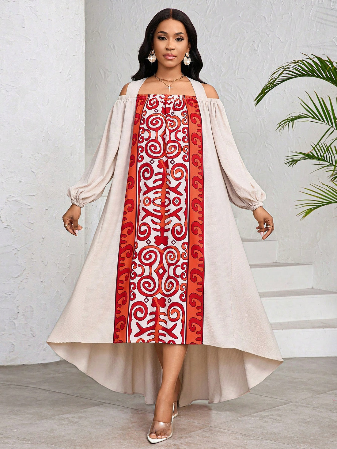 This floral print dress with open shoulders and lantern sleeves is the perfect choice for your summer vacation wardrobe. Show off your playful side with its unique design, while staying cool and stylish all day long. A must-have for every woman's summer wardrobe.