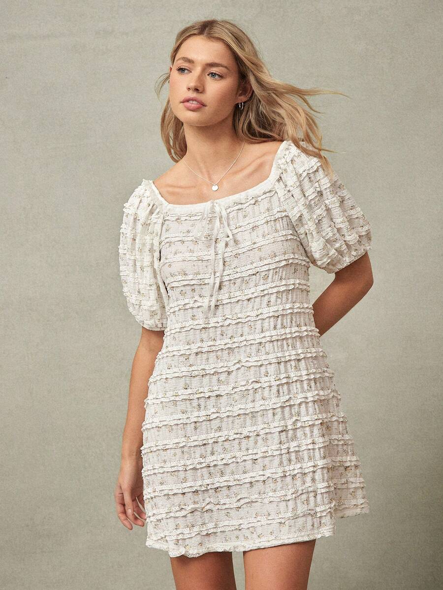 Exude effortless charm with this floral print square neck babydoll mini dress, a quintessential piece for the vibrant energy of Spring and Summer 2026 festivals. Designed with a classic square neckline and a breezy babydoll silhouette, this dress offers a playful yet sophisticated aesthetic that flatters every figure. The delicate floral motif and airy, high-quality fabric ensure you stay cool and comfortable during sun-drenched outdoor concerts, garden parties, or coastal getaways. Featuring romantic puffe