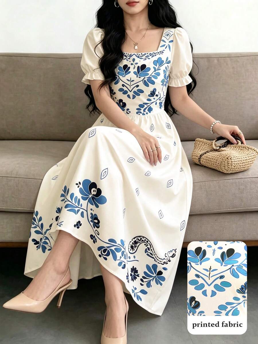 Front seated view of ivory floral midi dress with square neck puff sleeves and printed skirt