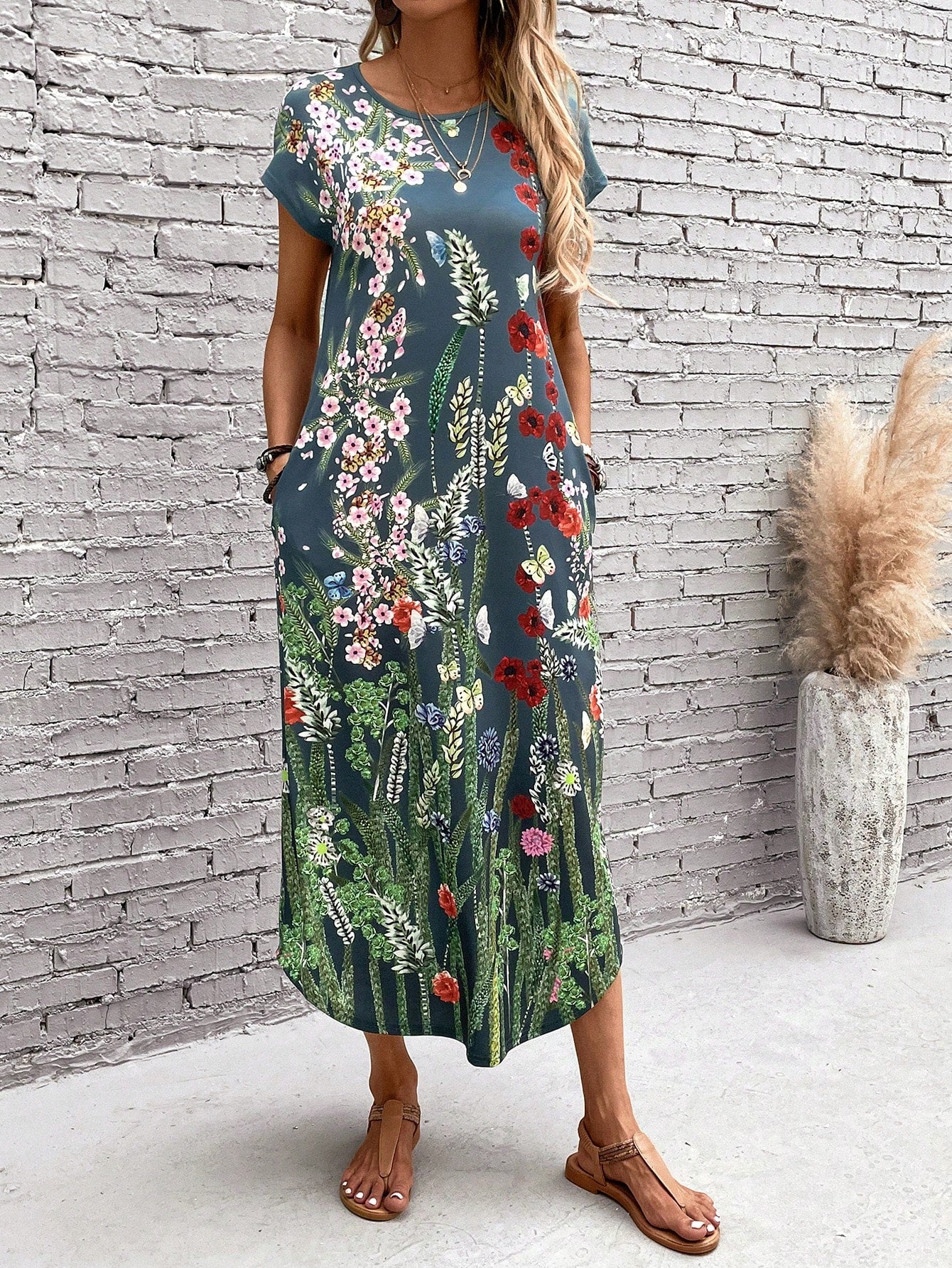 Effortlessly style up your wardrobe with this floral print tee dress! Not only does it showcase a trendy floral print, but it also offers hidden pockets for extra convenience. Enjoy the comfort and ease of this unique dress - perfect for any occasion!