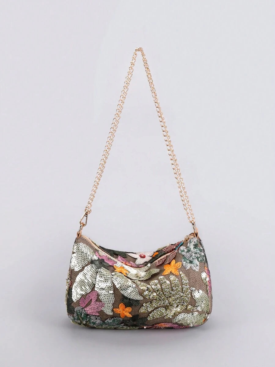 Add a splash of sparkle to your day with this Floral Sequin Embroidery Crossbody Bag! Its dazzling floral design and shimmering sequins make it the perfect playful accessory for any outfit. Lightweight and versatile, the chain shoulder strap lets you wear it hands-free, whether you're out shopping or dancing the night away. Stylish and practical, this bag keeps your essentials close while turning heads wherever you go.