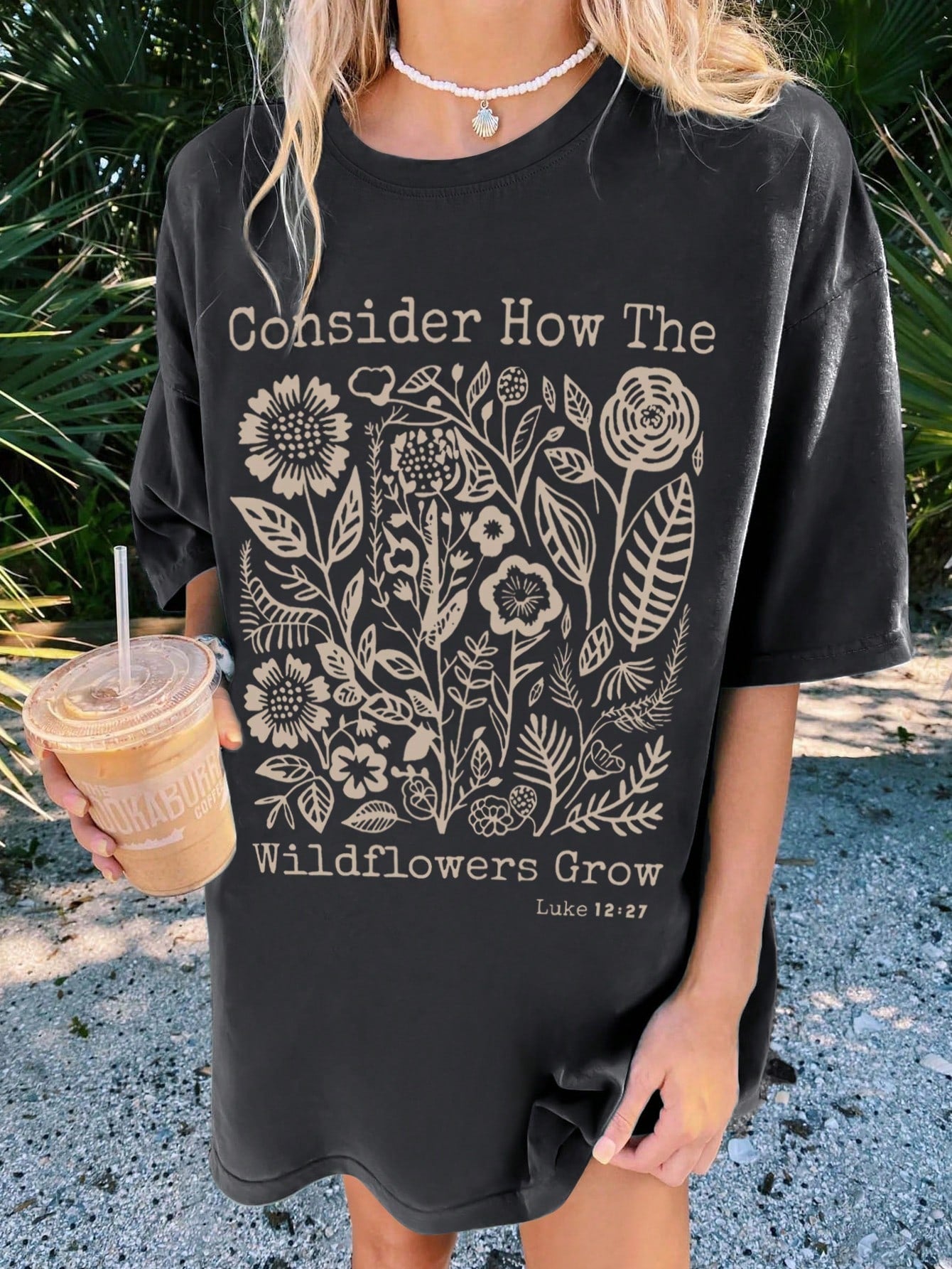 Get ready for summer vibes with this Floral Slogan Casual T-Shirt for Women. The drop shoulder style adds a touch of personality to this must-have piece. Made with high-quality materials, it's perfect for any casual occasion. Stay on-trend and comfortable with this stylish t-shirt.