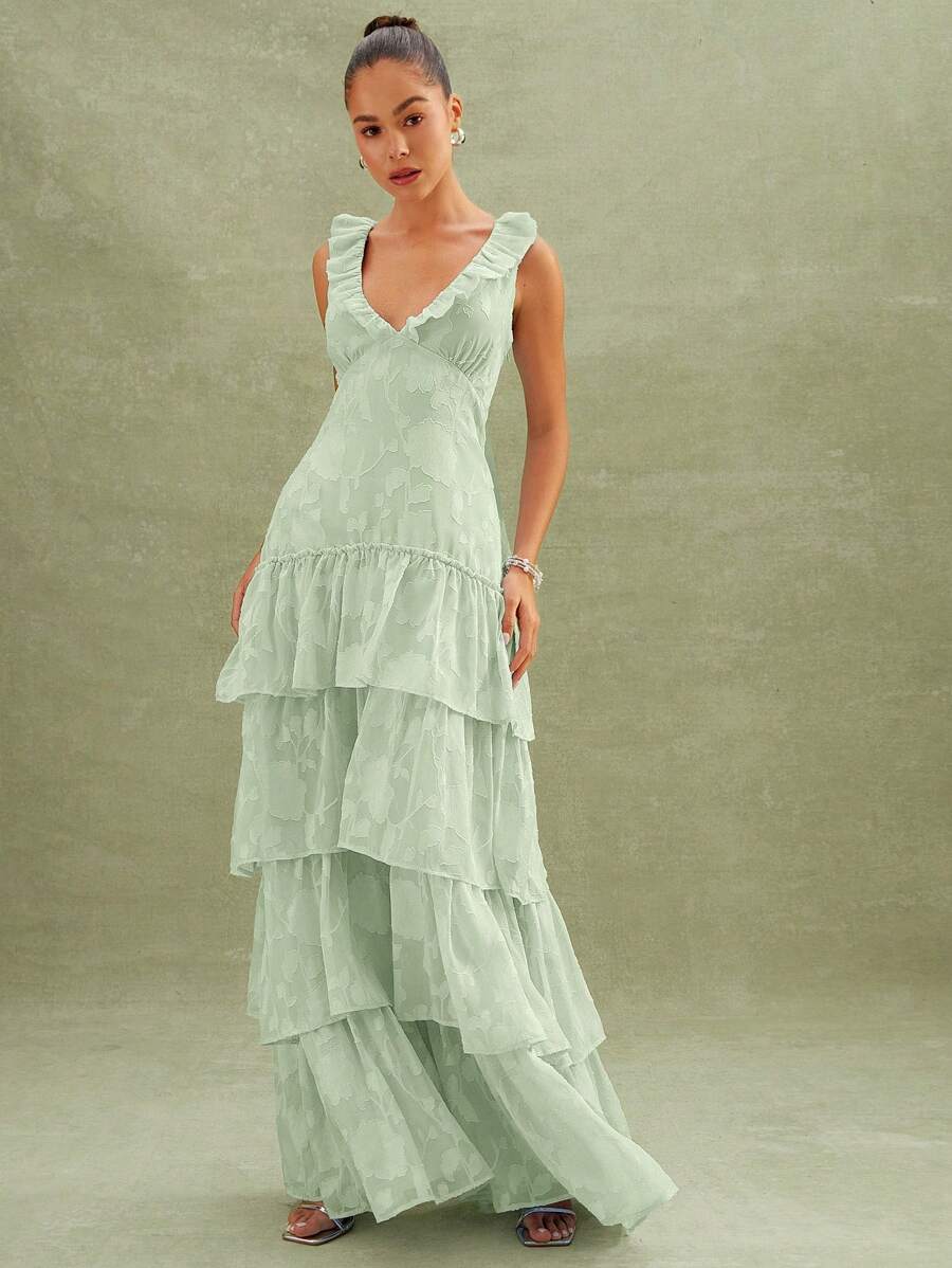 Step into effortless charm with this Floral Textured Tiered Ruffle Maxi Dress. Its playful tiered ruffles and delicate floral texture add a breezy, boho vibe perfect for anything from garden parties to weekend getaways. Comfortable and flowy, it’s your go-to for turning heads and feeling fabulous all day long.