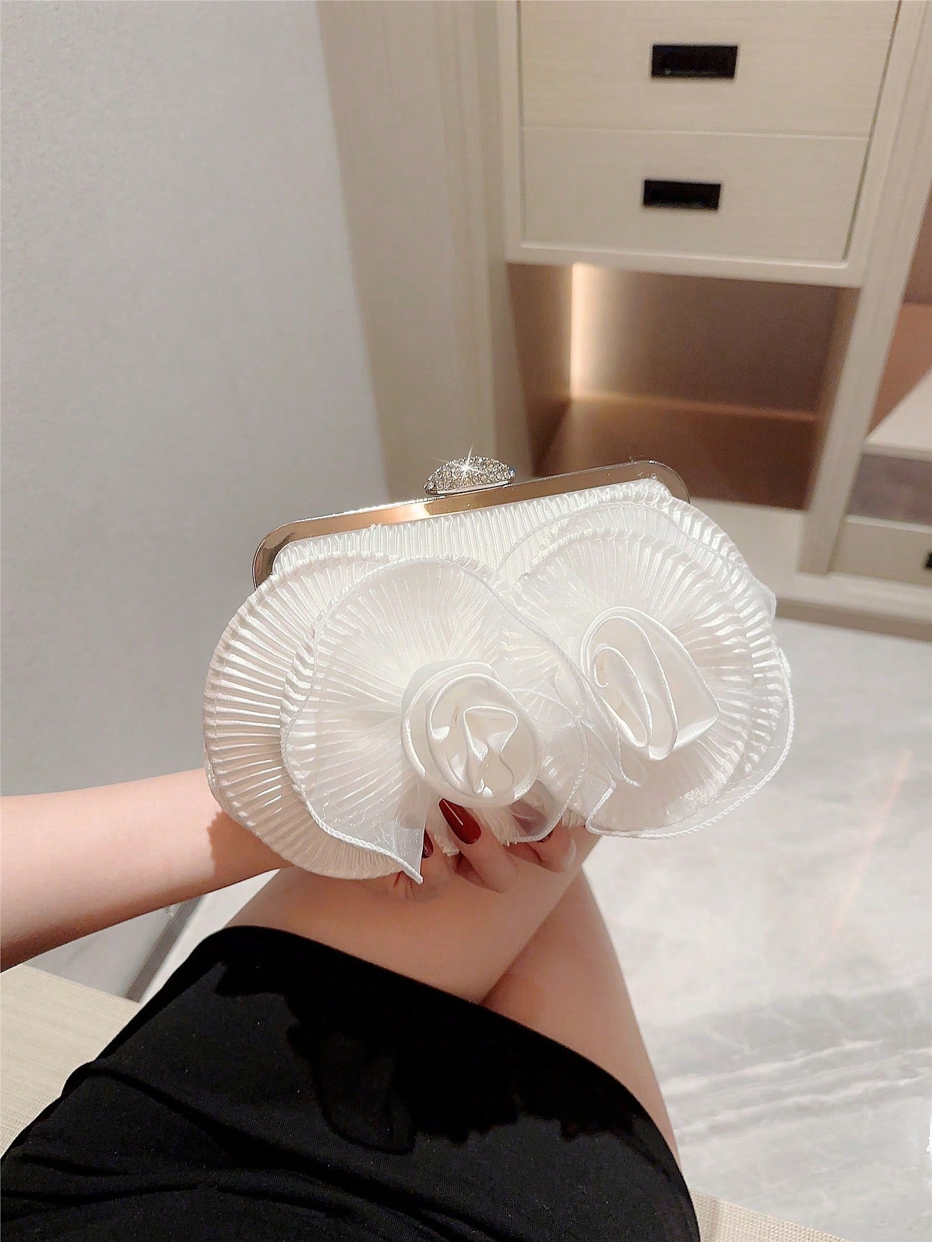Make a statement with our elegant white flower clutch, perfect for romantic weddings or formal celebrations. The beautiful floral design adds a touch of sophistication to any outfit. Carry all your essentials while adding a touch of romance to your look. Elevate your style with our Flower Clutch!