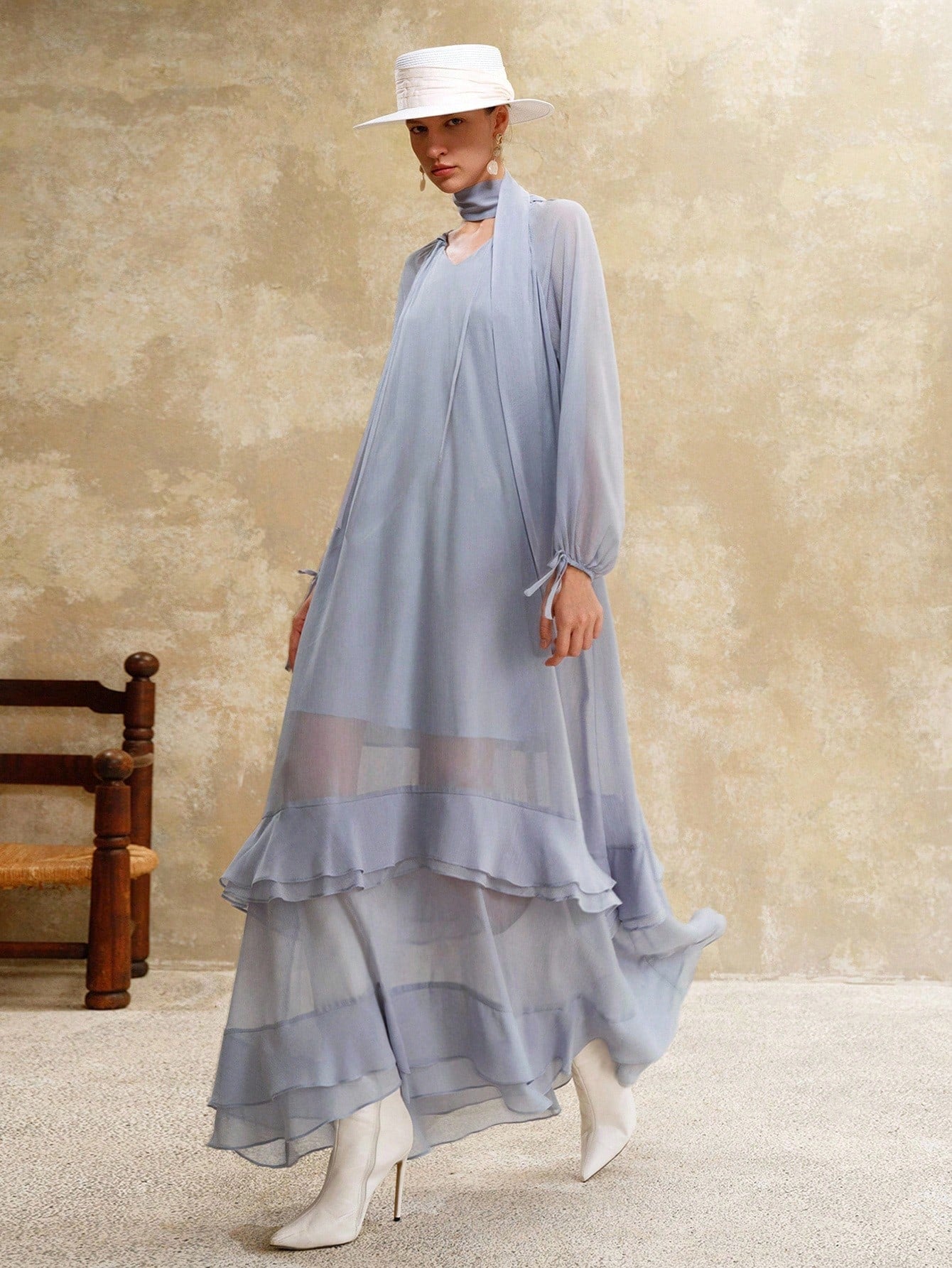 Embrace breezy elegance with this Flowy V-Neck Lantern Sleeve Maxi Dress. Crafted from lightweight chiffon, it dances with every step, perfect for sunny vacations or turning heads at classy gatherings. The playful lantern sleeves add a whimsical touch, making comfort and style your new summer essentials.