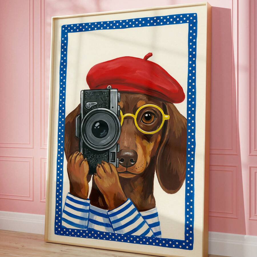 Framed dachshund photographer wall art leaning against pink wall