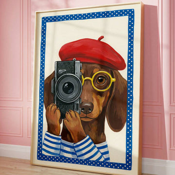 Framed dachshund photographer wall art leaning against pink wall