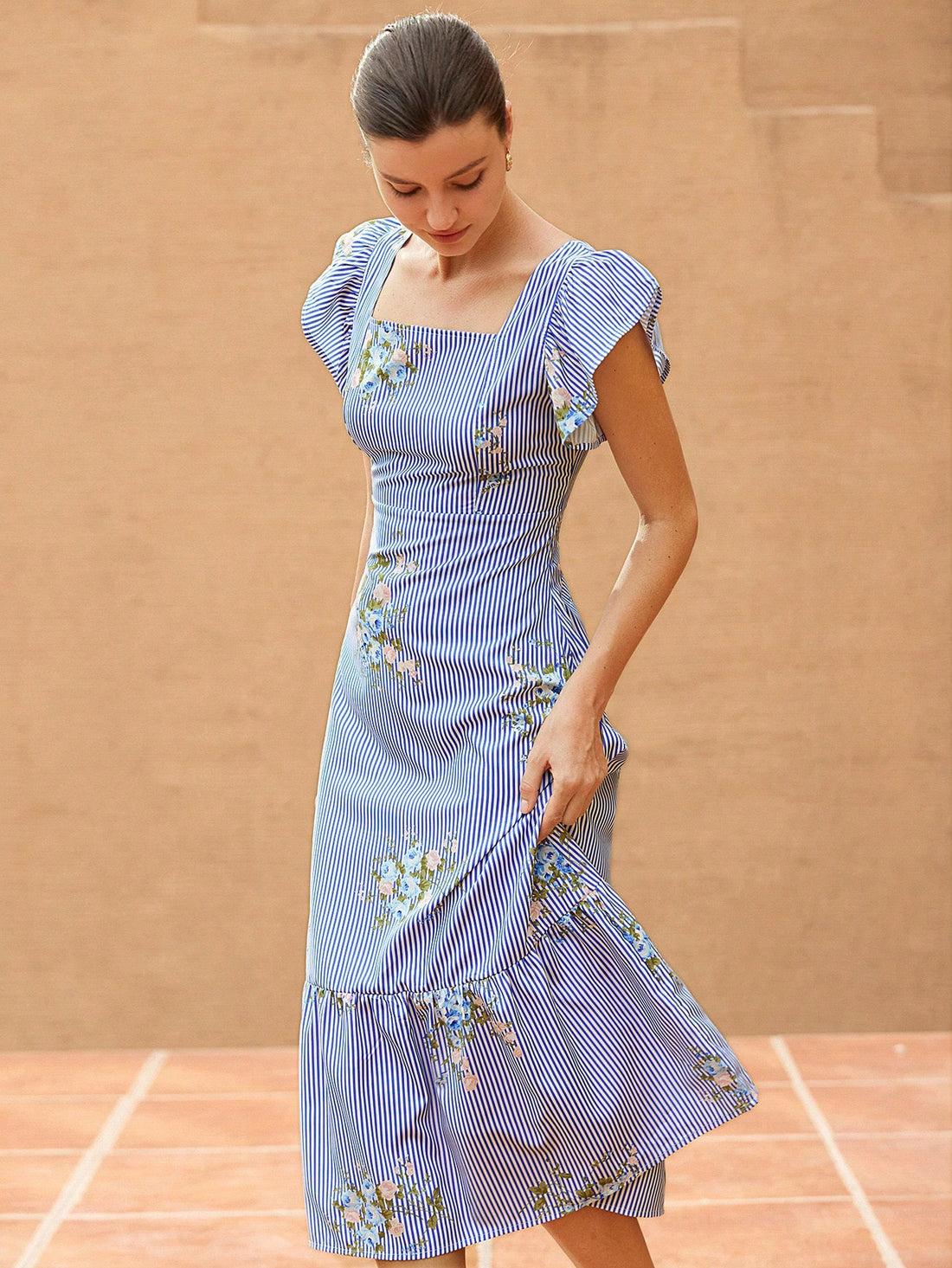 Feel effortlessly chic in our French Elegant Maxi Dress! The V-neck and sleeveless design adds a touch of elegance while the ruffle flounce and striped floral patchwork bring a playful twist. With a cinched waist to flatter your figure, this dress is perfect for any occasion.