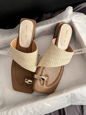 Step into summer with these charming French retro woven toe ring sandals that bring vintage flair to your warm-weather wardrobe. Featuring a sturdy chunky heel and intricate woven detailing, these sandals deliver both comfort and timeless style. The signature toe ring design adds a playful, bohemian touch perfect for casual outings, beach days, or leisurely strolls. Crafted with a retro aesthetic that never goes out of style, they're your go-to pair for effortless, chic summer looks that turn heads wherever