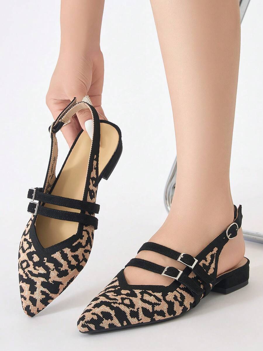 Close front view of leopard print pointed toe slingback flats with double buckle straps
