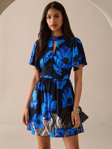 Step out in style with this playful blue mini dress featuring a charming full floral print and a flirty keyhole neckline. Its short sleeves keep it breezy and perfect for urban adventures or romantic evenings. Lightweight and fun, it’s your go-to for turning heads wherever you go.