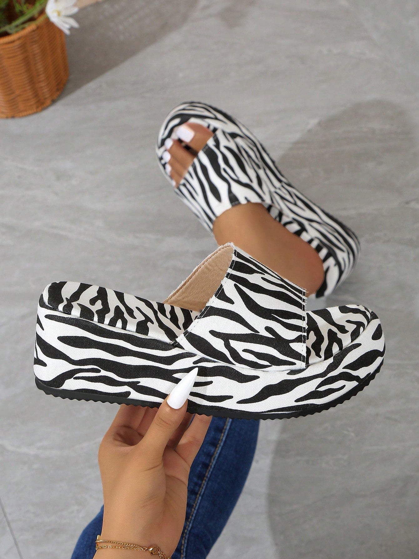 Step up your shoe game with our Funky Zebra Print Platform Wedge Slippers. These stylish slippers feature a bold zebra print that will make a statement wherever you go. With a comfortable platform wedge, you can add height while staying comfortably stylish. A must-have addition to your shoe collection.