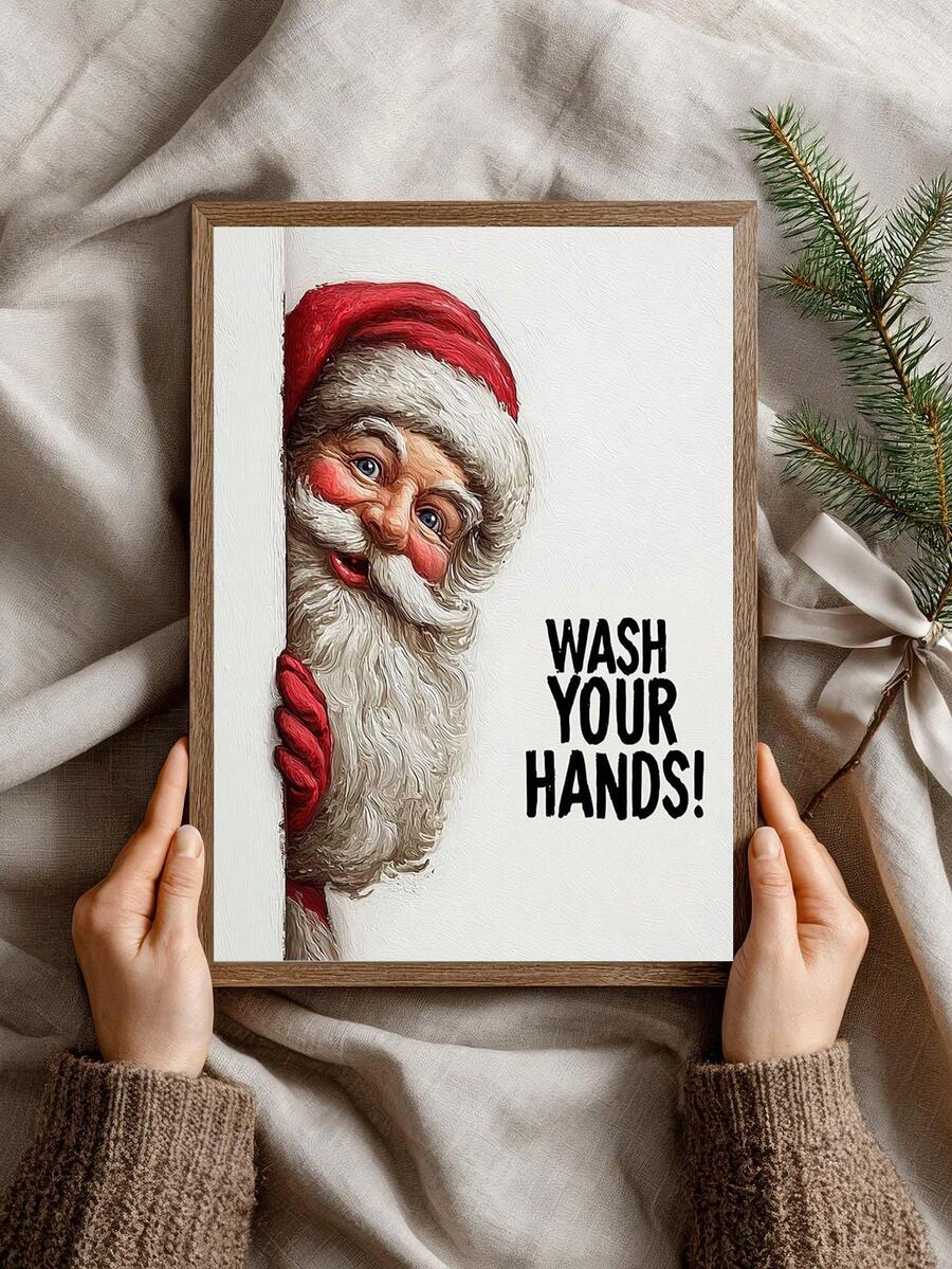 Portrait view of framed Santa canvas print with red hat and bold wash your hands lettering, held against neutral fabric