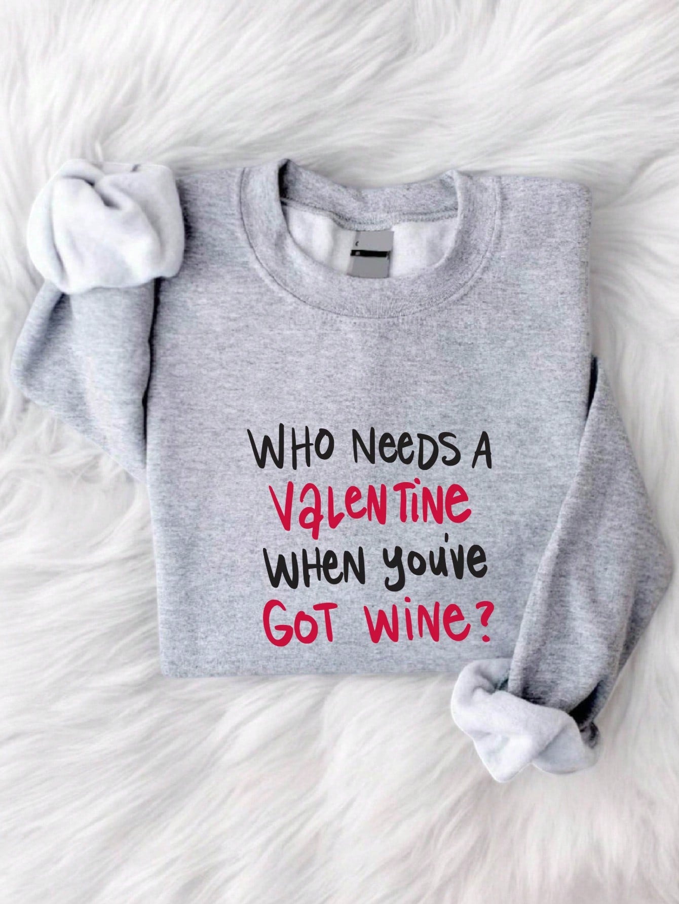 Who needs a Valentine when you've got wine? This hilarious sweatshirt for women features a funny slogan that guarantees to bring a smile to your face. Whether you're celebrating solo or with your friends, this sweatshirt will keep you cozy and stylish while also making a statement. Cheers to that!