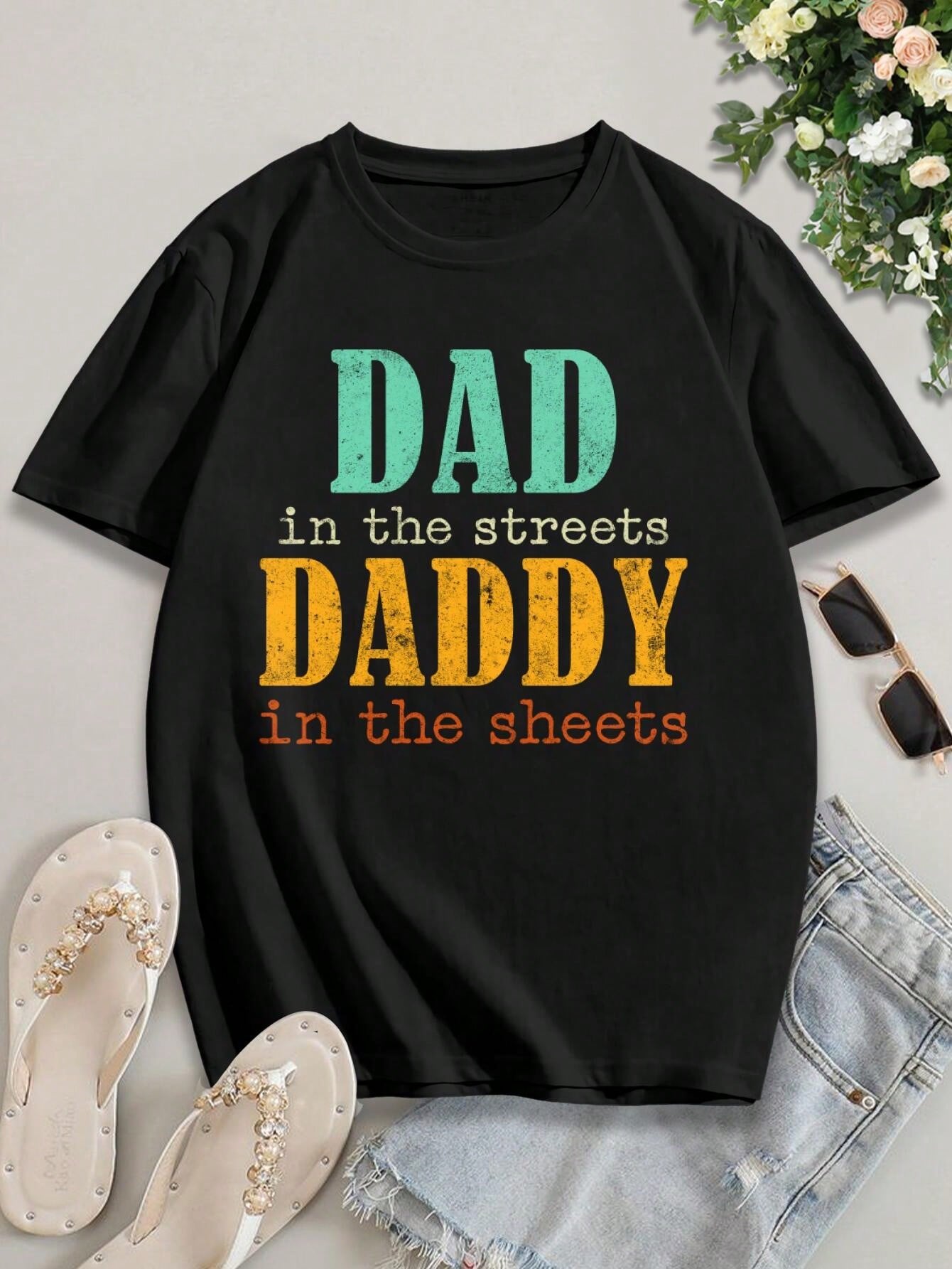 Spice up your Valentine's Day with our hilarious T-Shirt. Featuring the playful phrase "Dad in the Streets, Daddy in the Sheets", this shirt is perfect for those who don't take themselves too seriously. Show off your quirky sense of humor with this unique design. (2 exclamation points)