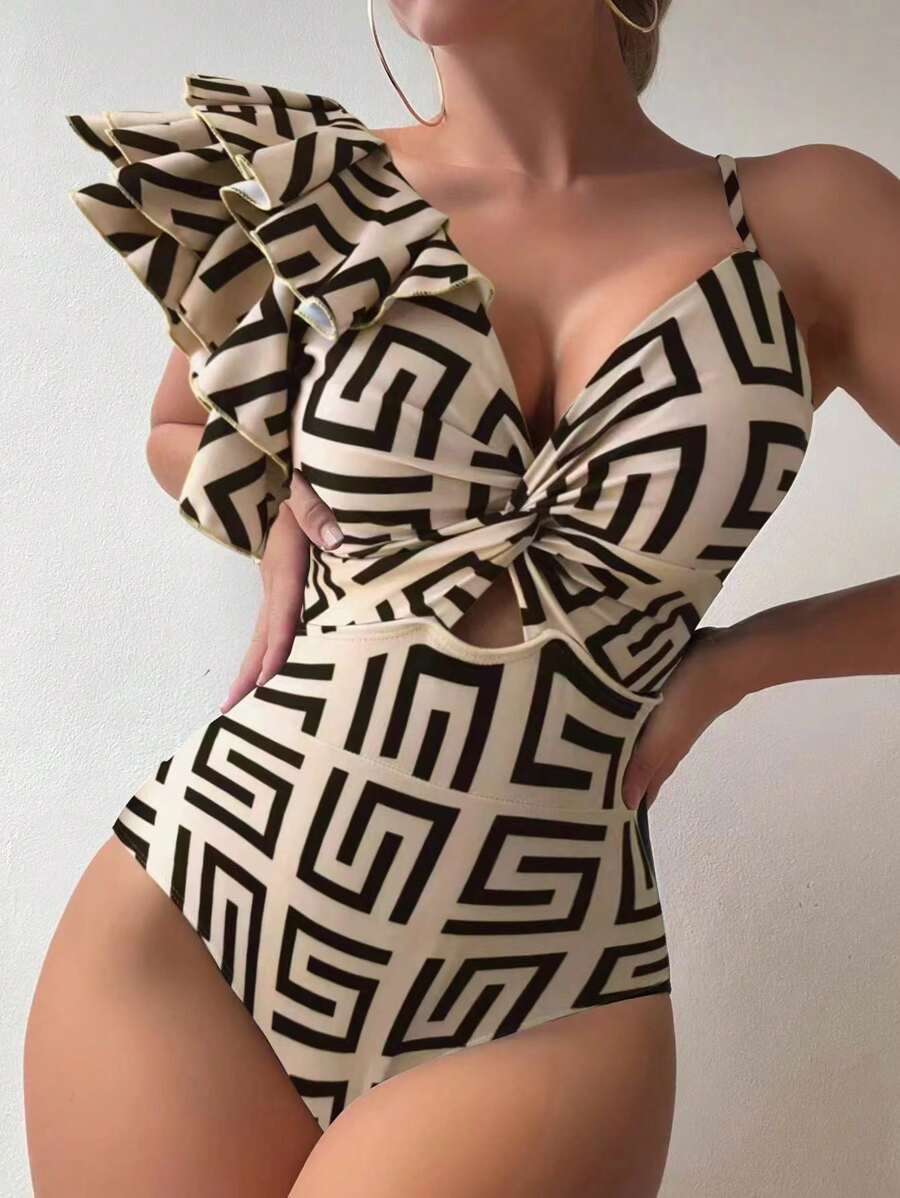 Make a splash this summer in our Geometric Print Ruffle One-Piece Swimsuit, designed for confident beach style. The bold geometric pattern pairs beautifully with delicate ruffles that add movement and dimension, while the asymmetrical cutout creates a modern, flattering silhouette. Crafted for comfort and durability, this one-piece offers the perfect balance of playful design and timeless elegance. Whether you're lounging poolside or catching waves, this swimsuit delivers style that turns heads.