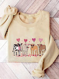 Get cozy with this sweatshirt perfect for cattle lovers! Surprise your animal enthusiast Valentine with this quirky gift. With its soft fabric and lovable design, they won't want to take it off. (Moo-ve over, boring gifts! This sweatshirt brings the fun).
