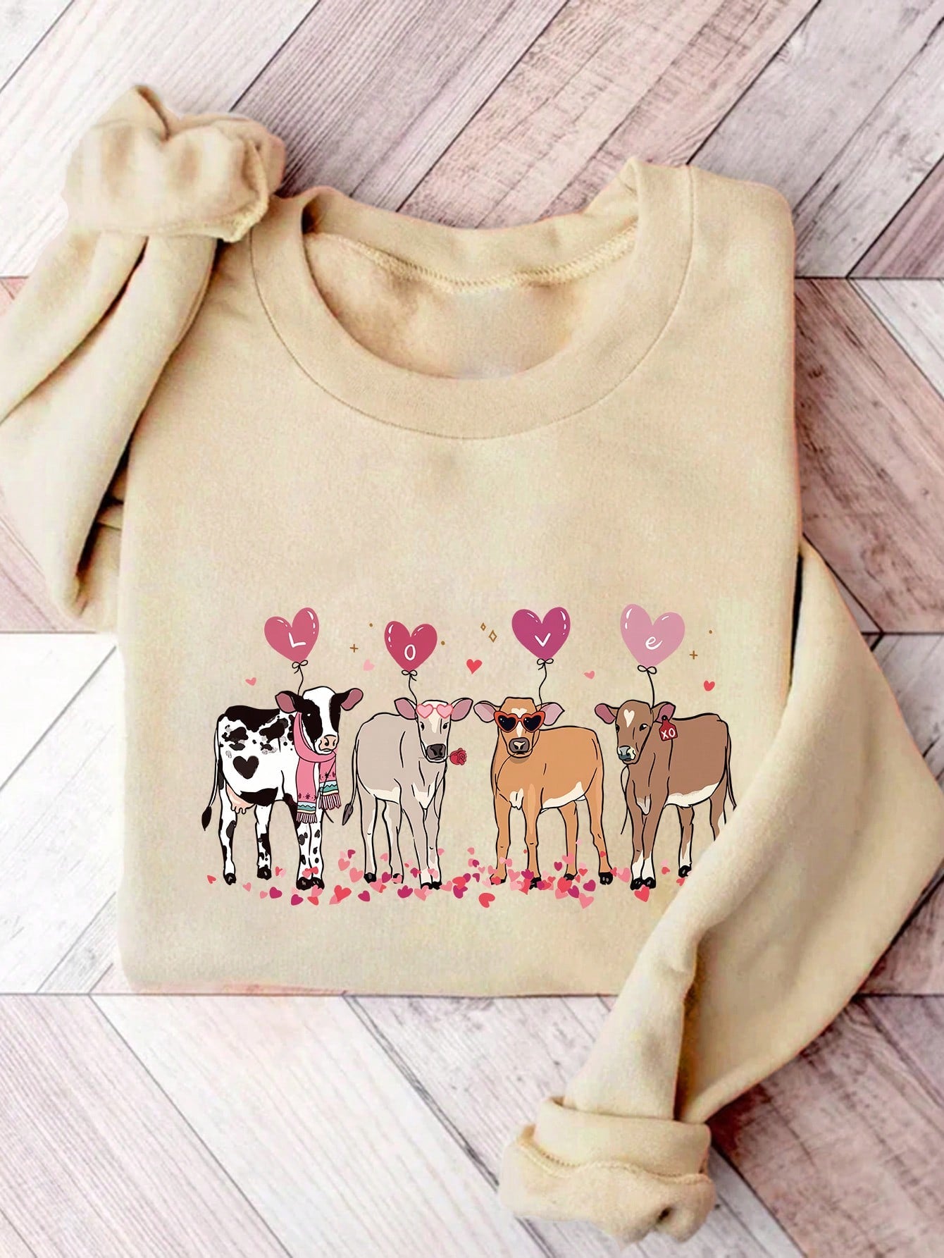 Get cozy with this sweatshirt perfect for cattle lovers! Surprise your animal enthusiast Valentine with this quirky gift. With its soft fabric and lovable design, they won't want to take it off. (Moo-ve over, boring gifts! This sweatshirt brings the fun).