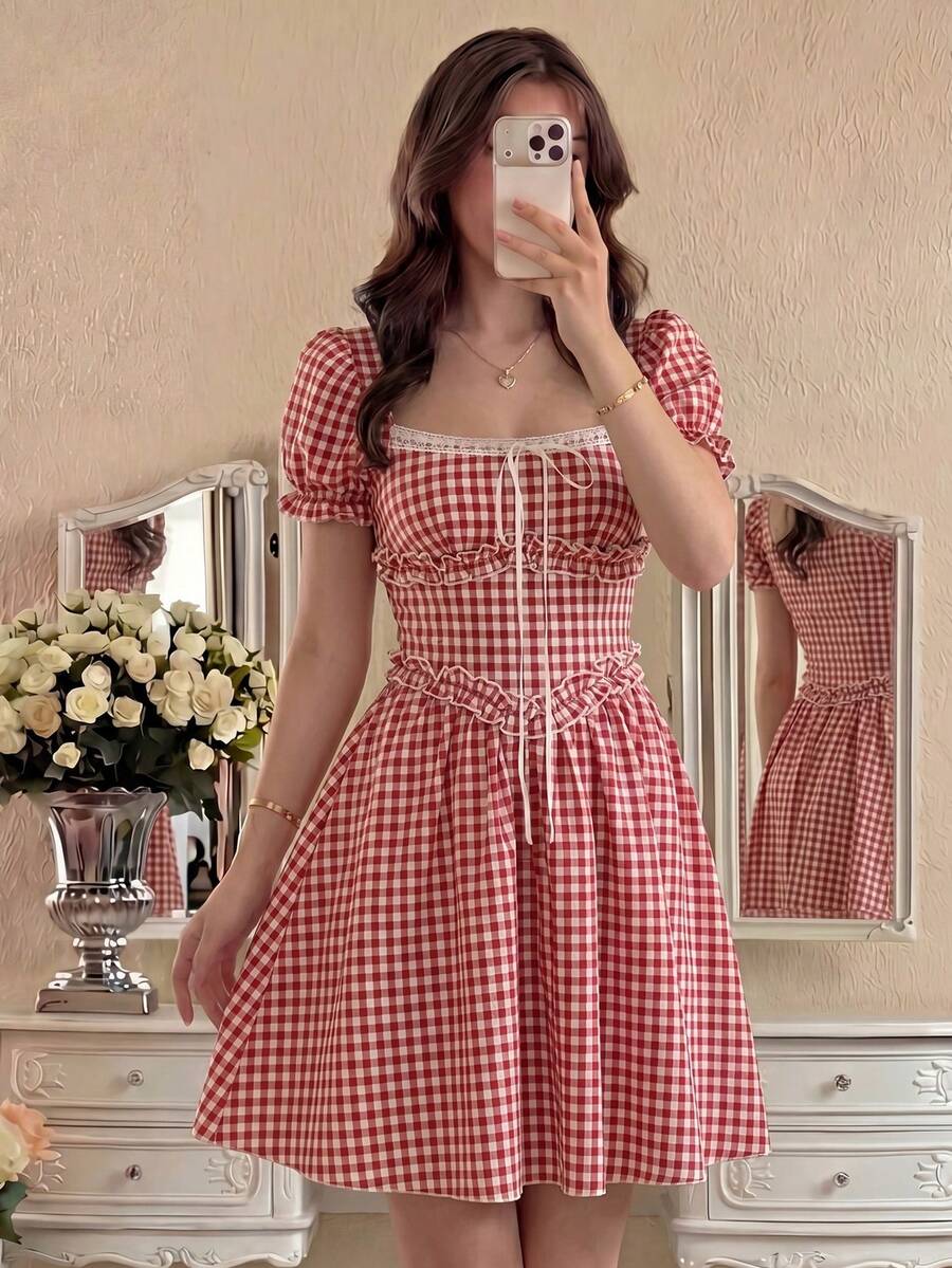 Embrace vintage charm with this enchanting gingham off-shoulder mini dress. Featuring a flattering A-line silhouette with puff sleeves, ruched bust detail, and a high waistline, it's the perfect piece for summer picnics and romantic garden gatherings. The red and white plaid pattern captures classic cottagecore aesthetics, while the flared hem adds playful movement. Crafted from a breathable cotton-polyester blend in a comfortable regular fit