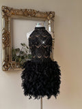 Step into the spotlight with this dazzling black sequin dress, designed to turn heads at every festival, party, or special event. Its playful tassel details sway with every move, while the backless cut adds a touch of daring glamour. Shine bright and dance the night away in a look that’s as fun and fabulous as you are!