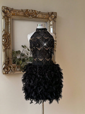 Step into the spotlight with this dazzling black sequin dress, designed to turn heads at every festival, party, or special event. Its playful tassel details sway with every move, while the backless cut adds a touch of daring glamour. Shine bright and dance the night away in a look that’s as fun and fabulous as you are!