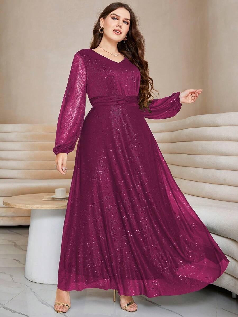 Step into the spotlight with this dazzling Plus Lantern Sleeve Twist Front Glitter Maxi Dress. Designed to sparkle from every angle, its flattering twist front and dramatic lantern sleeves add a playful flair perfect for evening occasions. Feel glamorous and confident as the glitter catches the light, ensuring all eyes are on you all night long.