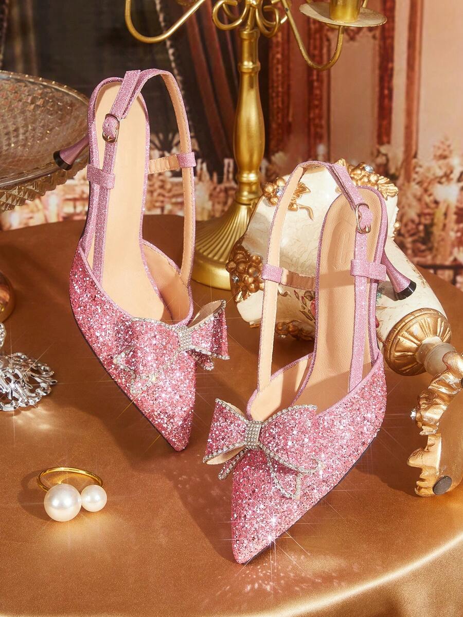 Step into elegance with these stunning rhinestone bow high heel pumps, designed to elevate any occasion. Featuring a dazzling crystal-embellished bow detail and a refined silhouette, these pumps deliver sophisticated glamour with every step. The carefully engineered heel provides a flattering lift while maintaining wearability for extended wear. Perfect for Valentine's Day celebrations, evening events, or whenever you want to make a memorable impression. These versatile party shoes combine eye-catching spar