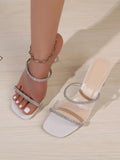White rhinestone clear strap mule sandal shown on foot with matching heel beside