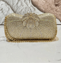Add a pop of sparkle to your outfit with this Glamorous Rhinestone Rainbow Clutch Bag. Perfect for weddings or fancy nights out, its dazzling rhinestones catch the light beautifully while the rainbow hues keep things fun and lively. The crossbody design lets you dance the night away hands-free, making it a stylish and practical choice for your next special event.