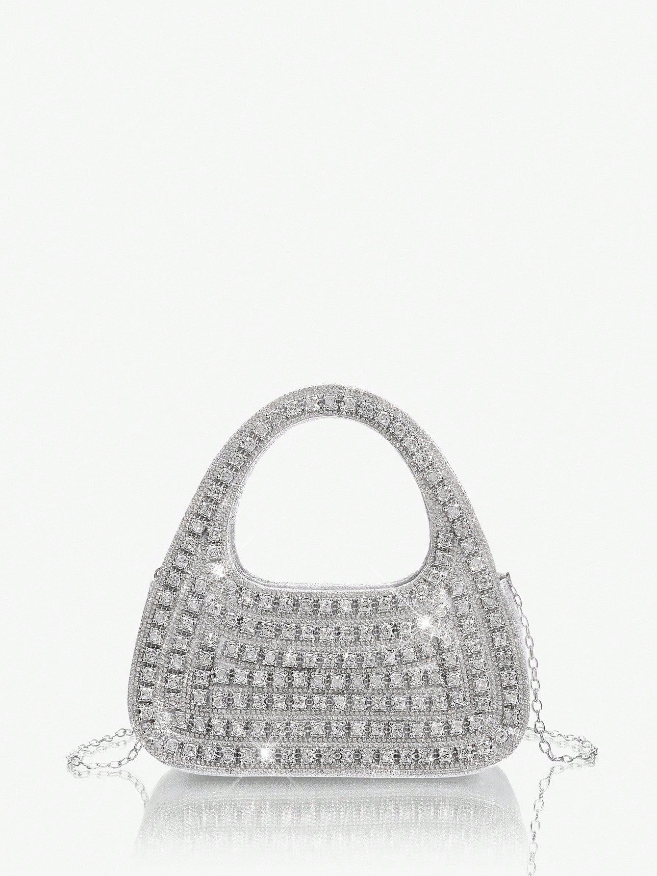Add sparkle to your night with this Glamorous Silver Bling Evening Bag. Perfect for parties and special occasions, it’s your go-to accessory to dazzle effortlessly. Compact yet chic, it holds your essentials while shimmering with every move you make. Turn heads and steal the spotlight wherever you go!