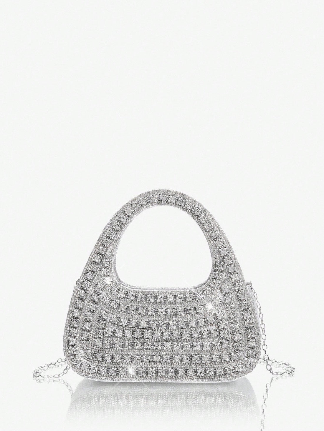 Add sparkle to your night with this Glamorous Silver Bling Evening Bag. Perfect for parties and special occasions, it’s your go-to accessory to dazzle effortlessly. Compact yet chic, it holds your essentials while shimmering with every move you make. Turn heads and steal the spotlight wherever you go!