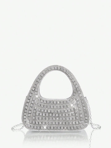 Add sparkle to your night with this Glamorous Silver Bling Evening Bag. Perfect for parties and special occasions, it’s your go-to accessory to dazzle effortlessly. Compact yet chic, it holds your essentials while shimmering with every move you make. Turn heads and steal the spotlight wherever you go!