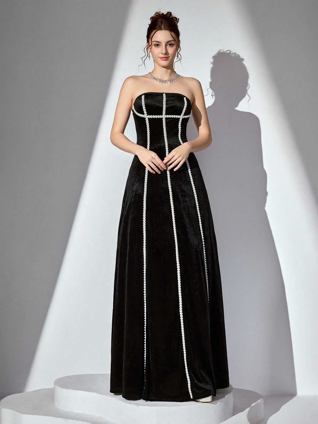 Slip into pure elegance with this show-stopping velvet cocktail dress that's ready to turn heads at any celebration. The luxurious strapless silhouette flatters every figure, while delicate faux pearl embellishments add a touch of sparkle and sophistication. Perfect for wedding receptions, prom nights, or any special occasion where you want to feel absolutely fabulous. The rich velvet fabric drapes beautifully and catches the light in all the right ways, ensuring you'll be the most glamorous guest in the ro