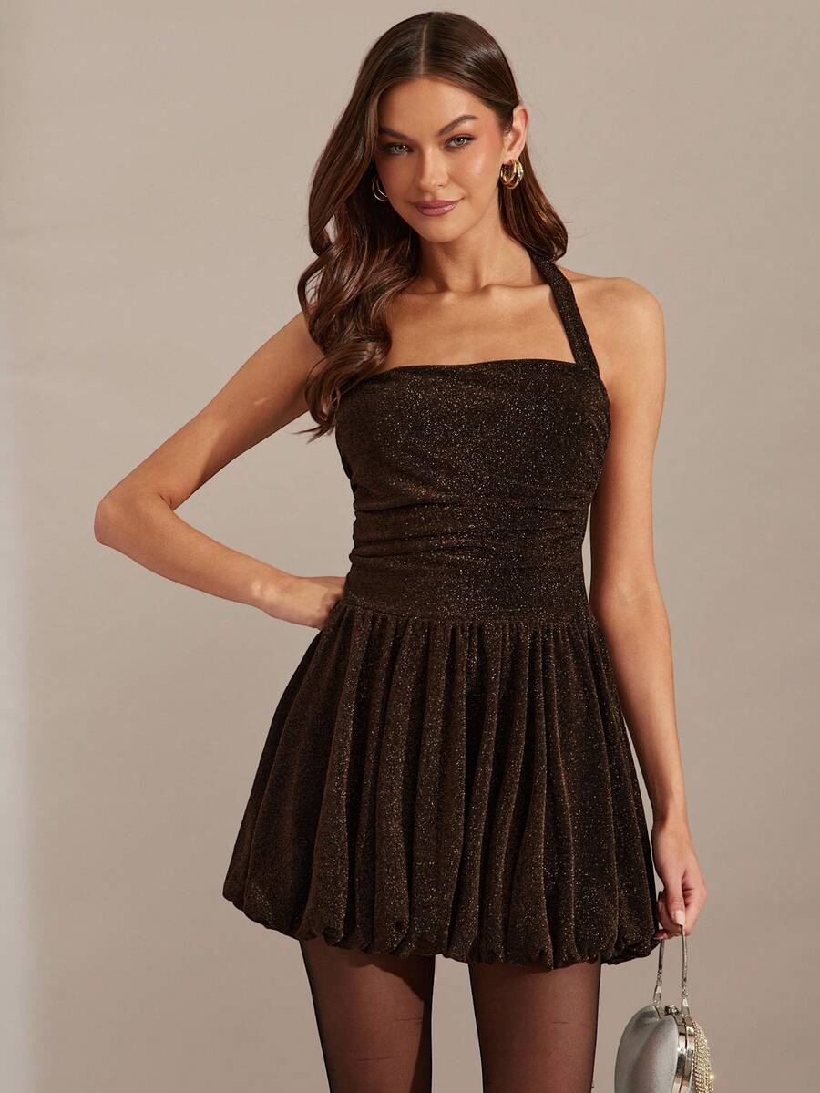 View 1 of glitter halter bubble skirt mini dress with square neckline, backless tie neck, ruched waist, and sparkle fabric