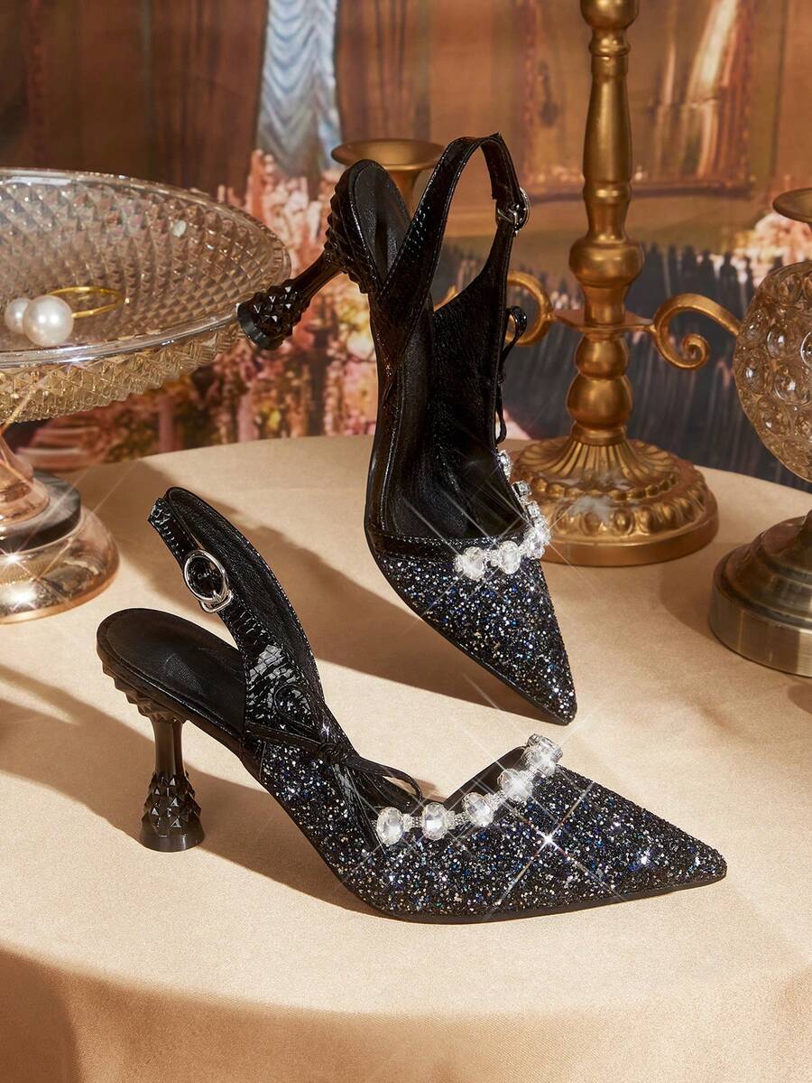 Elevate your seasonal wardrobe with these glittering bowknot high heels, a breathtaking fusion of high-octane glamour and sophisticated edge. Designed for the transitional beauty of spring and autumn, these heels feature a dazzling shimmering finish and an oversized signature bow that captures the light with every step. The addition of a chic metallic chain strap provides both a secure, adjustable fit and a modern, jewelry-inspired aesthetic that wraps elegantly around the ankle. Crafted with a cushioned in