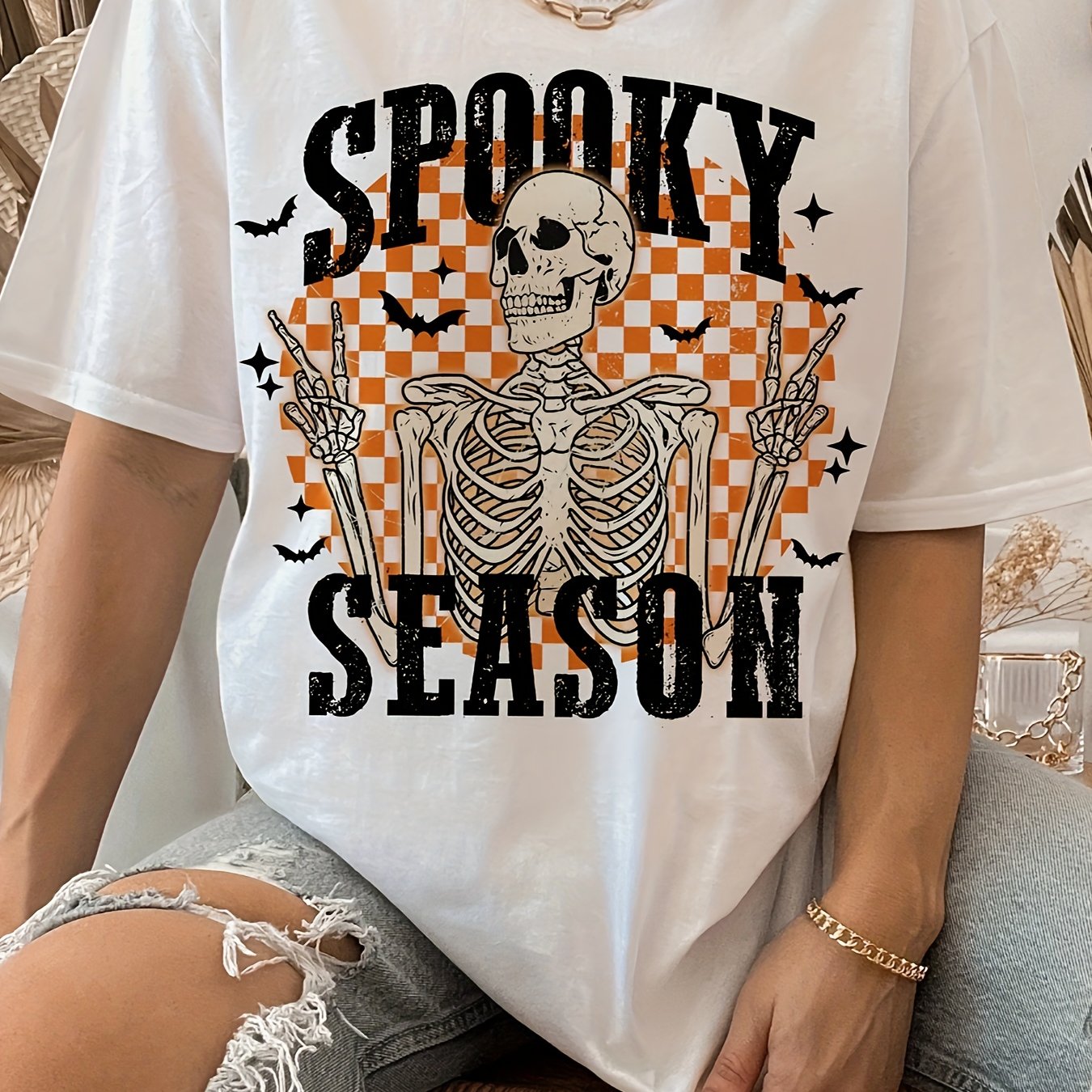 Stand out this Halloween with our Glow in the Dark Skeleton T-Shirt for women. The skeleton letter print glows in the dark, making it perfect for a spooky night out. This t-shirt is also lightweight and perfect for spring and summer. Get ready to turn heads and light up the night!