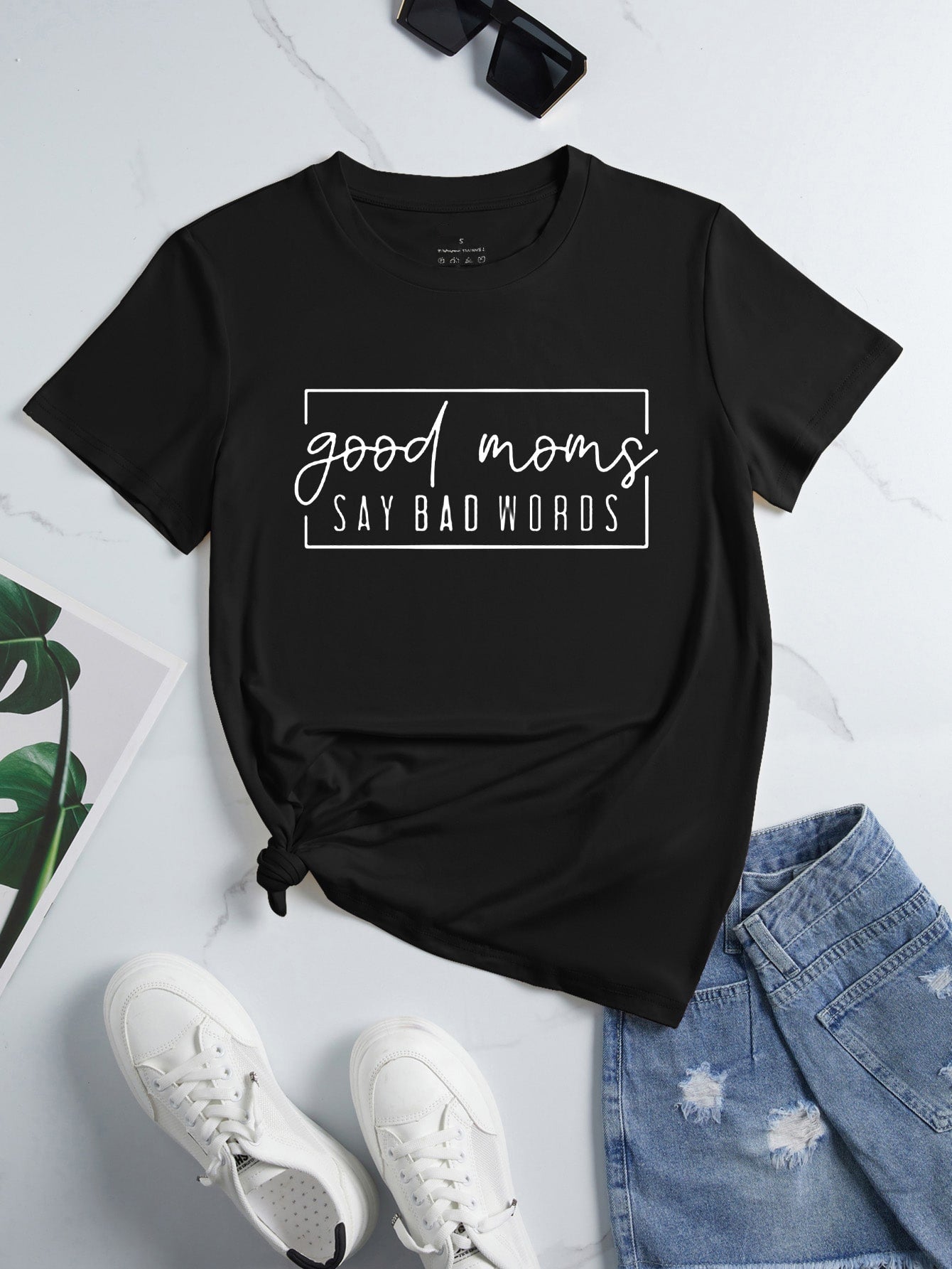 Embrace the fun and show off your playful side with our Good Moms Say Bad Words Graphic Tee. Made with quality materials and a bold design, this tee is perfect for the mom who doesn't take herself too seriously. So go ahead, let out a few laughs and wear your mom badge loud and proud!
