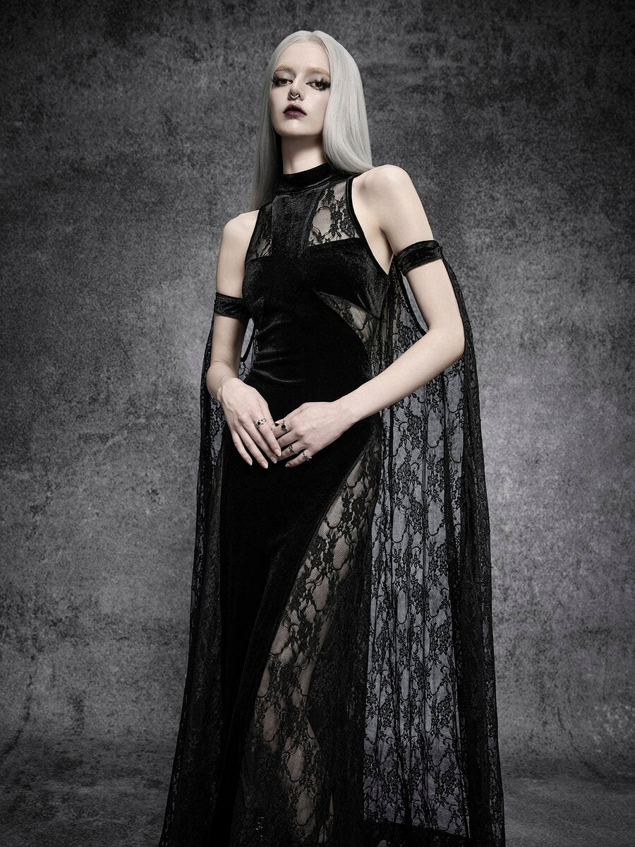 Model wearing black gothic velvet maxi dress with sheer lace cape and stand collar