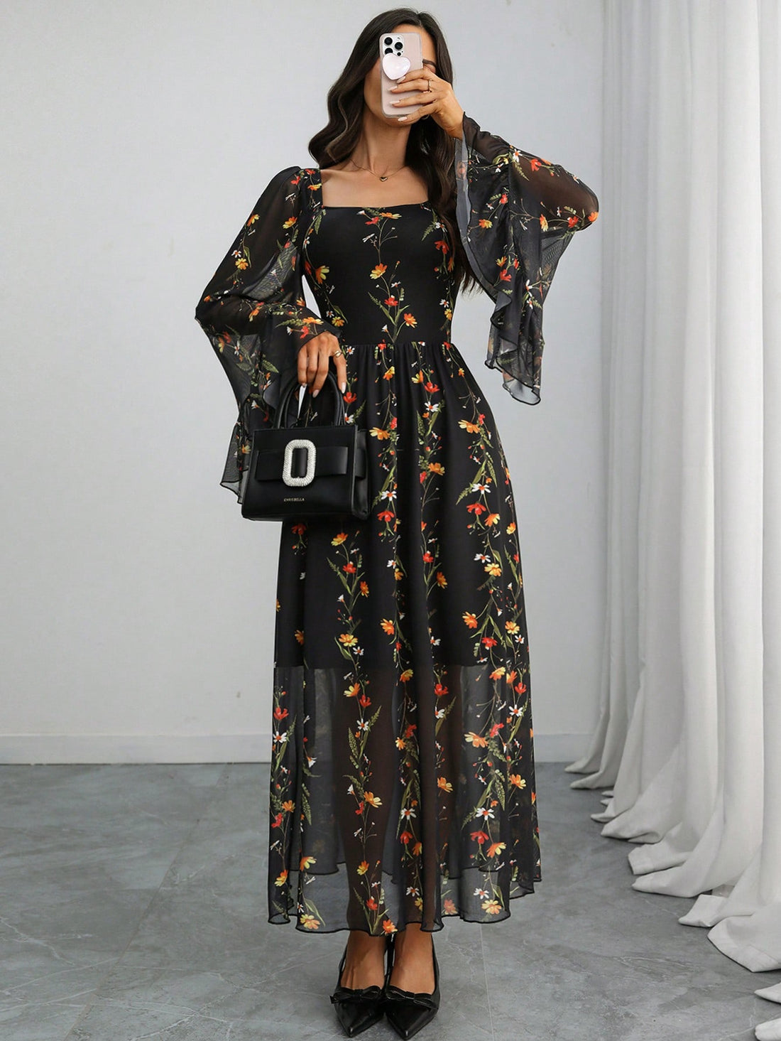 Embrace your inner dark romantic with this enchanting black floral chiffon maxi dress. The elegant French square neckline frames your shoulders beautifully, while billowing sleeves add an ethereal, dramatic flair. Crafted from lightweight chiffon, this floor-length stunner flows with every step, perfect for making a moody-yet-graceful statement. Whether you're channeling gothic elegance or romantic mystery, this dress transforms any occasion into something unforgettably theatrical and utterly captivating.