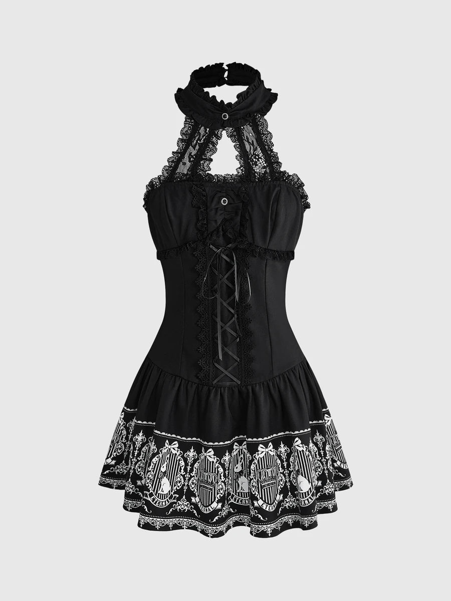Front view of black gothic halter mini dress with white graphic print, lace trim and bow