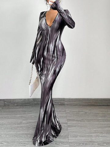 Effortlessly elevate your style with our Gradient Glam Maxi Dress. Featuring a slimming fit, v-neckline, and long sleeves for added elegance. The gradient design adds a touch of sophistication to this must-have dress. Experience effortless elegance with every wear.
